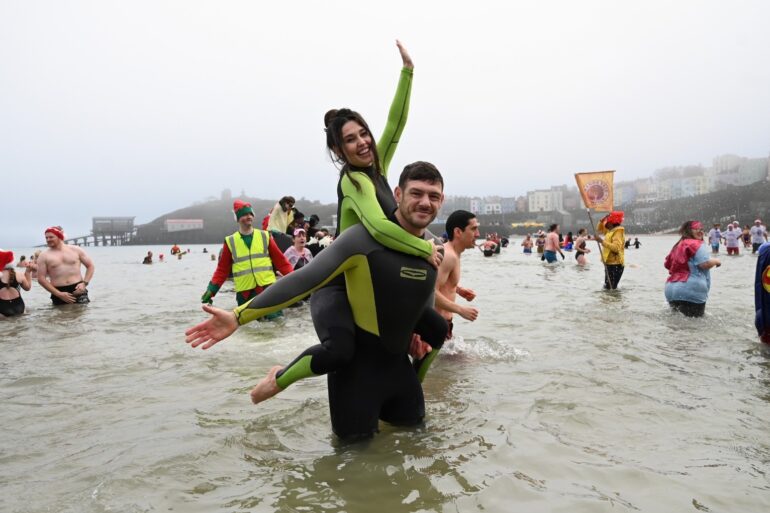 Romantic proposal makes waves at Tenby Boxing Day swim