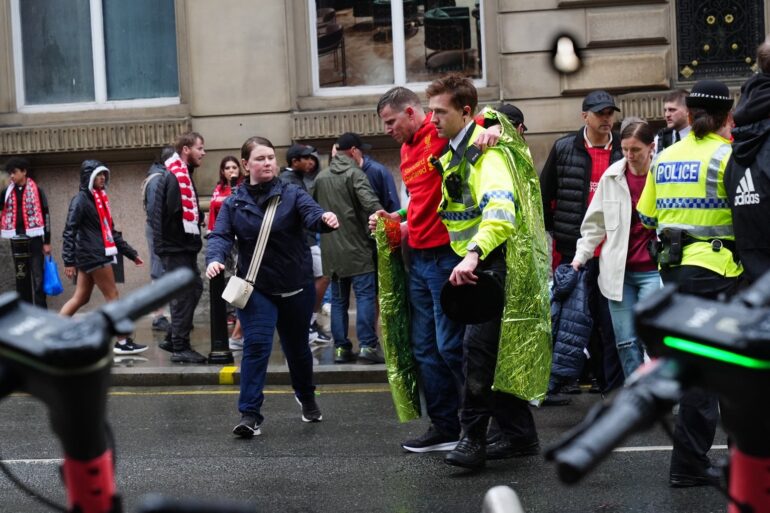 Man detained after car collides with pedestrians during Premier League parade