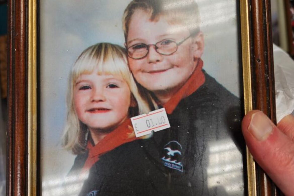 Siblings reunited with school photo found in charity shop 300 miles away