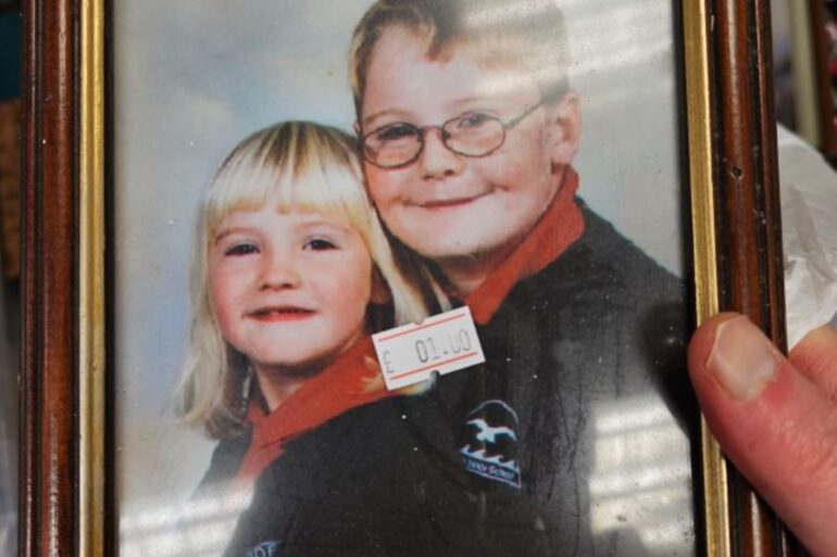 Siblings reunited with school photo found in charity shop 300 miles away